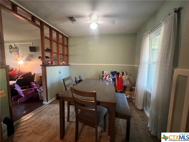 dining area featuring ceiling fan and dark hardwood / wood-style floors