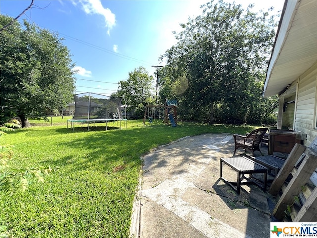 view of patio / terrace featuring a playground and a trampoline