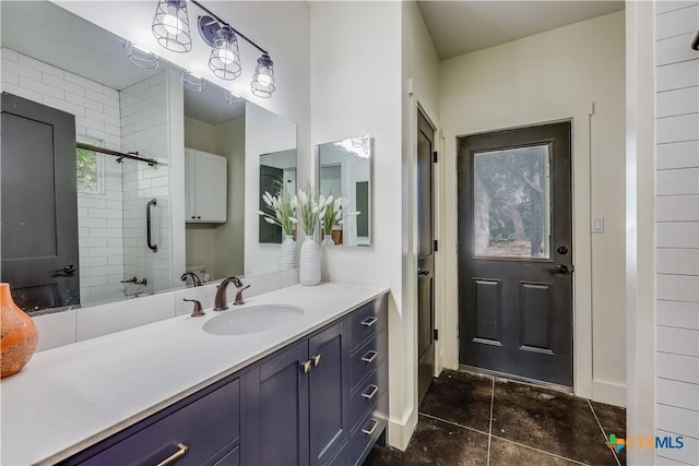 bathroom with vanity and an enclosed shower