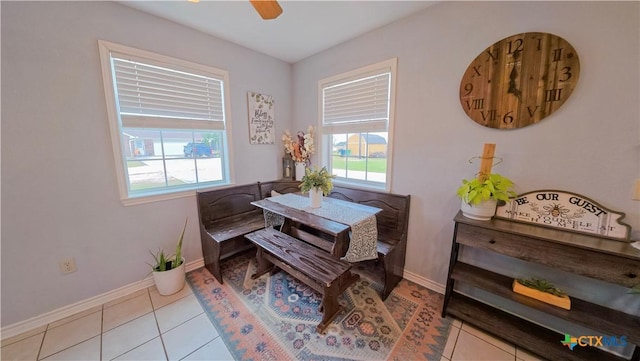 dining space featuring a healthy amount of sunlight, light tile patterned floors, and ceiling fan