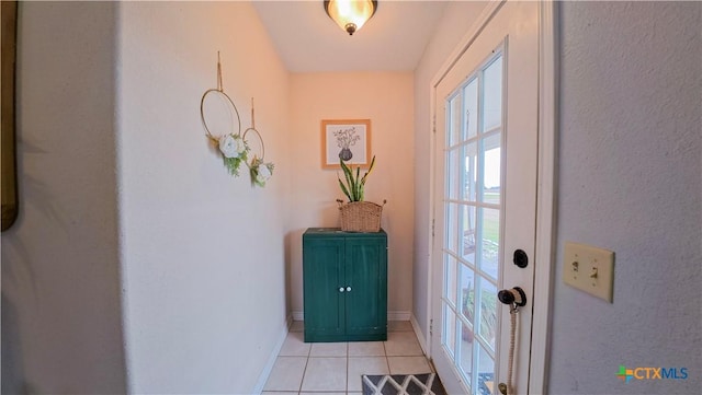 doorway featuring light tile patterned floors