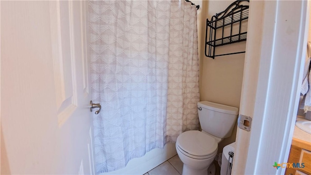 bathroom with shower / bath combination with curtain, toilet, tile patterned flooring, and a baseboard heating unit