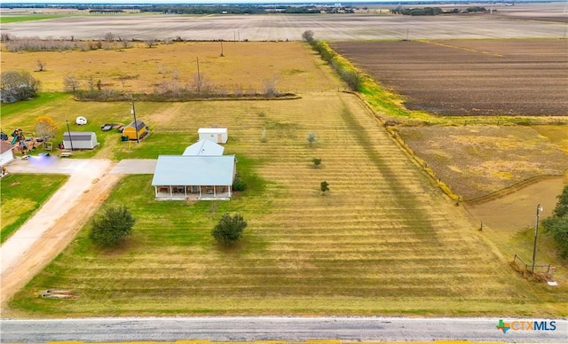 birds eye view of property with a rural view