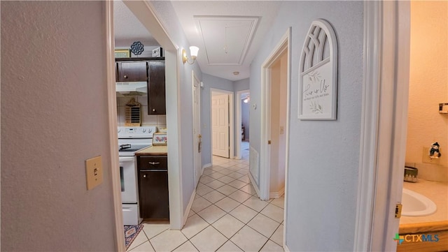 hallway with light tile patterned floors