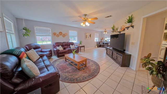 tiled living room featuring ceiling fan