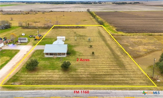 birds eye view of property featuring a rural view