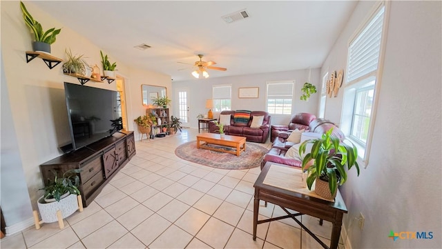 tiled living room featuring ceiling fan