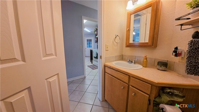 bathroom featuring tile patterned flooring and vanity