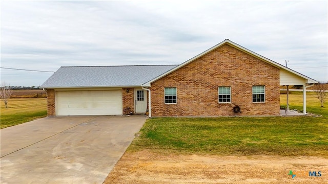 view of front of home with a garage and a front lawn