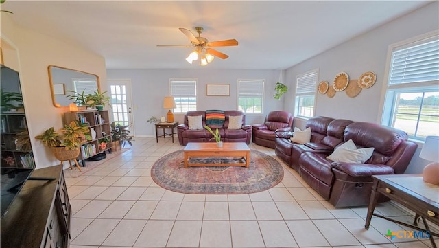 tiled living room featuring ceiling fan