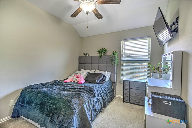 carpeted bedroom featuring lofted ceiling and ceiling fan