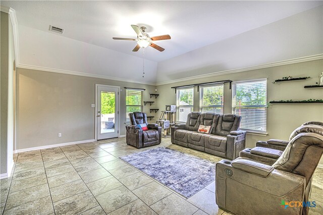 living room featuring a wealth of natural light, ceiling fan, crown molding, and vaulted ceiling