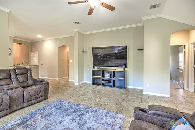 living room with ceiling fan and crown molding