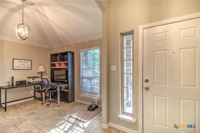 entrance foyer with ornamental molding, a chandelier, and vaulted ceiling