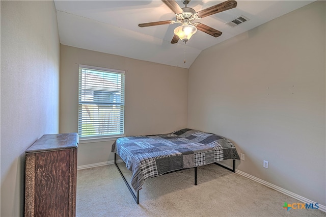 carpeted bedroom featuring lofted ceiling and ceiling fan