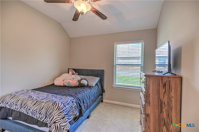 bedroom with ceiling fan, light carpet, and vaulted ceiling