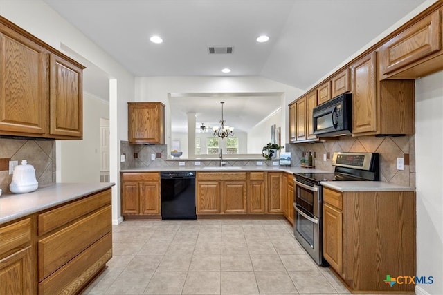 7778 Little Deer Trl, Georgetown, TX 78628 - kitchen with lofted ceiling, tasteful backsplash, black appliances, and visible vents