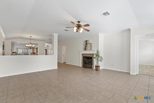 7778 Little Deer Trl, Georgetown, TX 78628 - unfurnished living room featuring light tile patterned floors, vaulted ceiling, ceiling fan with notable chandelier, and visible vents