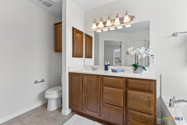 7778 Little Deer Trl, Georgetown, TX 78628 - full bath featuring toilet, a bath, visible vents, tile patterned flooring, and vanity