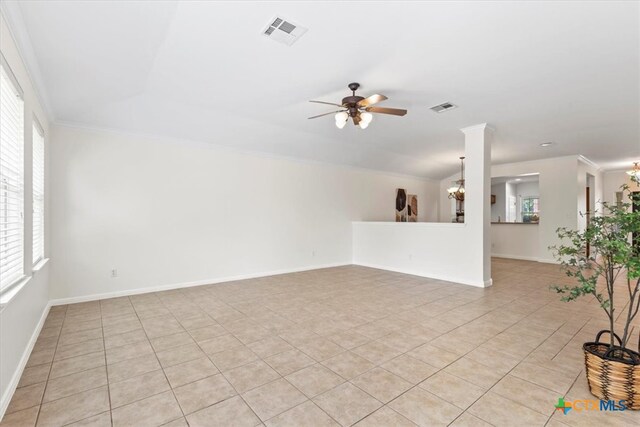 7778 Little Deer Trl, Georgetown, TX 78628 - unfurnished living room featuring a healthy amount of sunlight, ceiling fan with notable chandelier, and visible vents