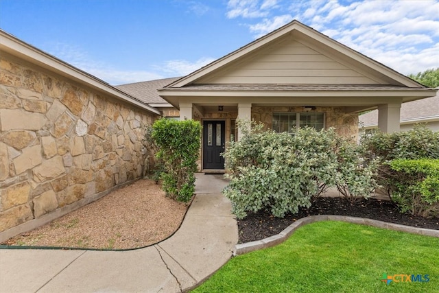 7778 Little Deer Trl, Georgetown, TX 78628 - view of front of home with stone siding and roof with shingles