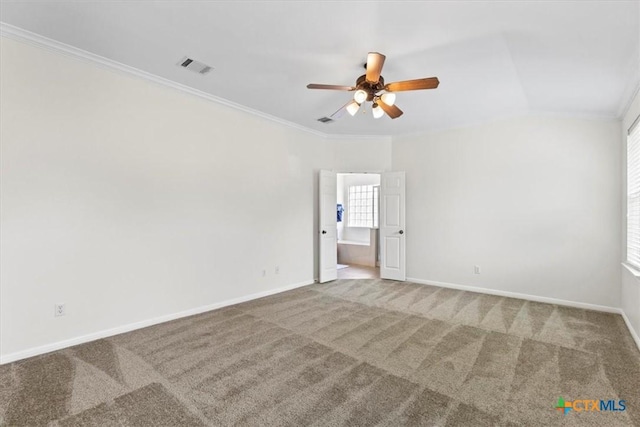 7778 Little Deer Trl, Georgetown, TX 78628 - carpeted spare room featuring ornamental molding, baseboards, a ceiling fan, and visible vents