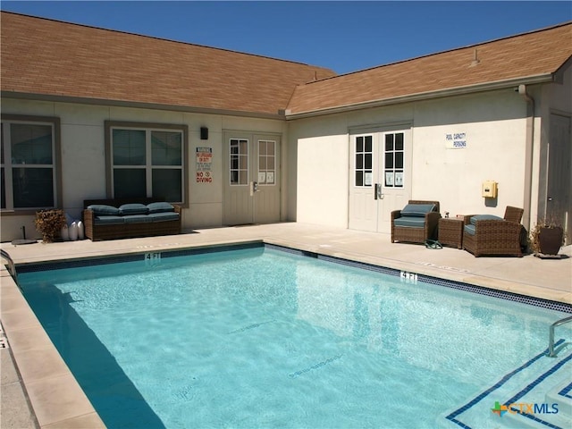 2400 Louis Henna Blvd Unit 305, Round Rock, TX 78664 - community pool with a patio and outdoor lounge area