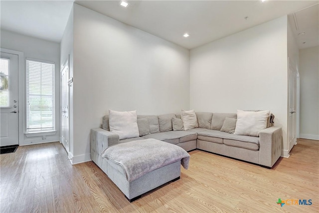 2400 Louis Henna Blvd Unit 305, Round Rock, TX 78664 - living room with baseboards, recessed lighting, and light wood-style flooring
