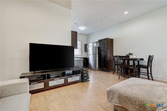2400 Louis Henna Blvd Unit 305, Round Rock, TX 78664 - living area with visible vents and light wood finished floors