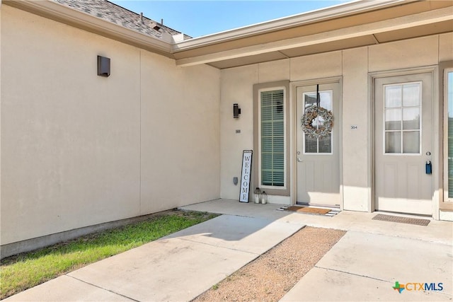 2400 Louis Henna Blvd Unit 305, Round Rock, TX 78664 - view of exterior entry with roof with shingles and stucco siding