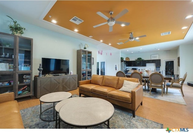 2400 Louis Henna Blvd Unit 305, Round Rock, TX 78664 - living room featuring visible vents, light wood-style flooring, and ceiling fan