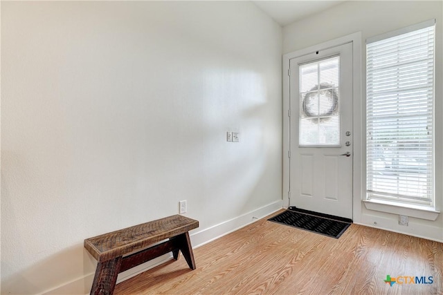 2400 Louis Henna Blvd Unit 305, Round Rock, TX 78664 - foyer entrance with baseboards and light wood-style flooring