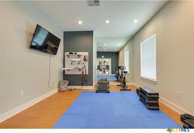 2400 Louis Henna Blvd Unit 305, Round Rock, TX 78664 - exercise room featuring baseboards, recessed lighting, wood finished floors, and visible vents