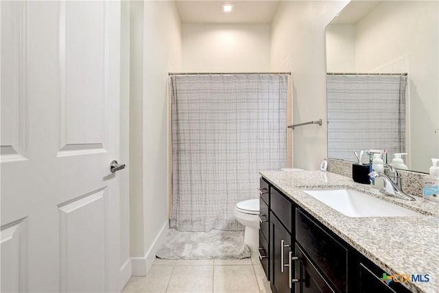 2400 Louis Henna Blvd Unit 305, Round Rock, TX 78664 - bathroom featuring vanity, tile patterned flooring, baseboards, and toilet
