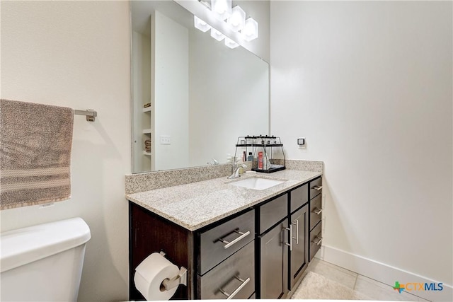 2400 Louis Henna Blvd Unit 305, Round Rock, TX 78664 - half bath featuring toilet, tile patterned floors, baseboards, and vanity
