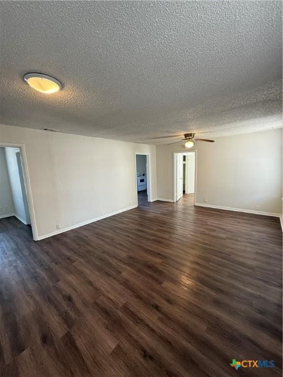 unfurnished room featuring a ceiling fan, a textured ceiling, baseboards, and dark wood-style flooring