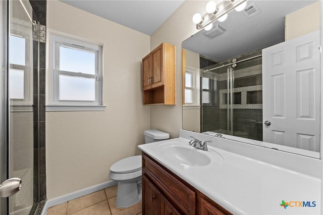 bathroom with tile patterned floors, toilet, an enclosed shower, and a wealth of natural light