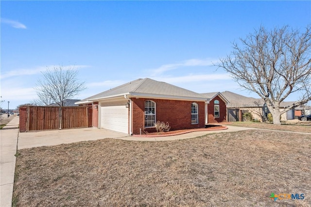 single story home with a garage and a front lawn