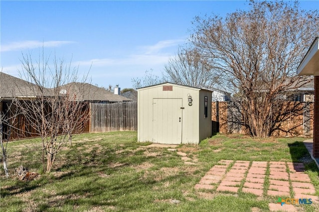 view of outdoor structure featuring a lawn