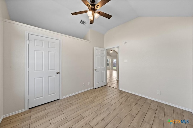 unfurnished bedroom featuring vaulted ceiling and ceiling fan