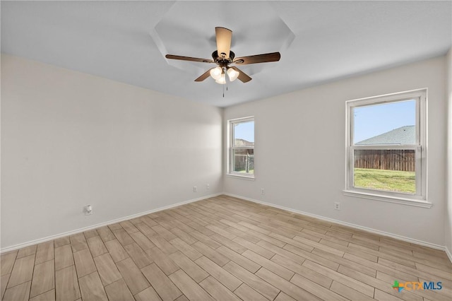 empty room featuring ceiling fan and light wood-type flooring