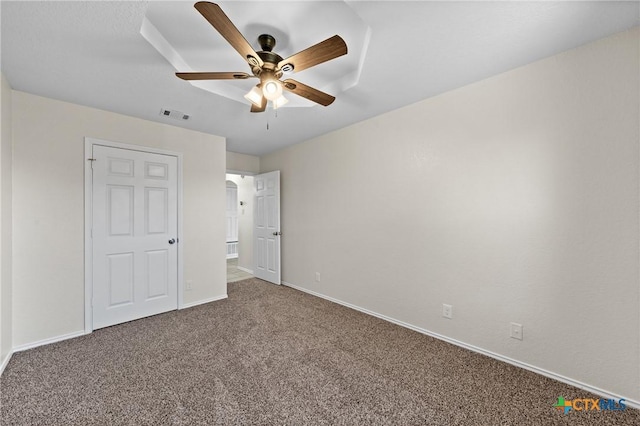 unfurnished bedroom with carpet floors and ceiling fan