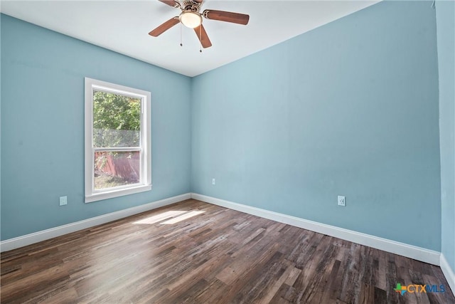 2212 Clay Ave, Waco, TX 76706 - empty room with dark wood finished floors, baseboards, and a ceiling fan