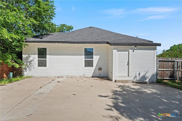 2212 Clay Ave, Waco, TX 76706 - back of house with a patio and roof with shingles