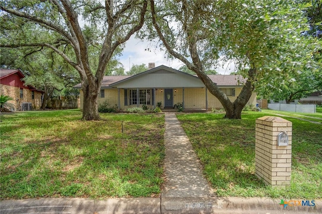 1705 Neuman St, Gonzales, TX 78629 - view of front of home featuring a chimney
