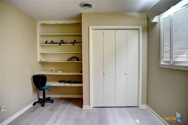 1705 Neuman St, Gonzales, TX 78629 - unfurnished office featuring wood finished floors and baseboards