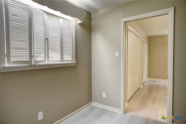 1705 Neuman St, Gonzales, TX 78629 - hallway with light wood-type flooring and baseboards