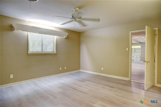 1705 Neuman St, Gonzales, TX 78629 - spare room with a ceiling fan, healthy amount of natural light, and wood finished floors
