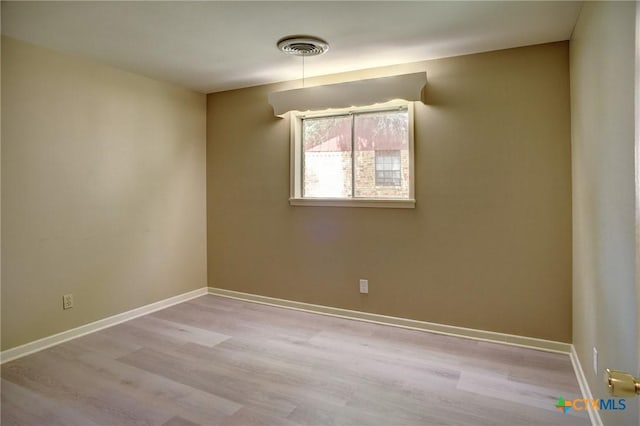1705 Neuman St, Gonzales, TX 78629 - unfurnished room featuring wood finished floors