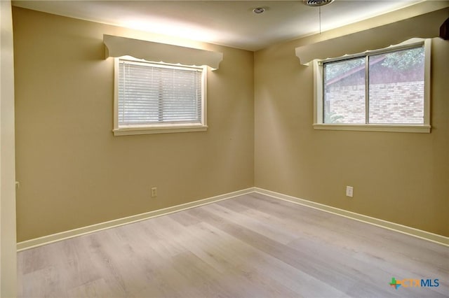 1705 Neuman St, Gonzales, TX 78629 - spare room featuring wood finished floors
